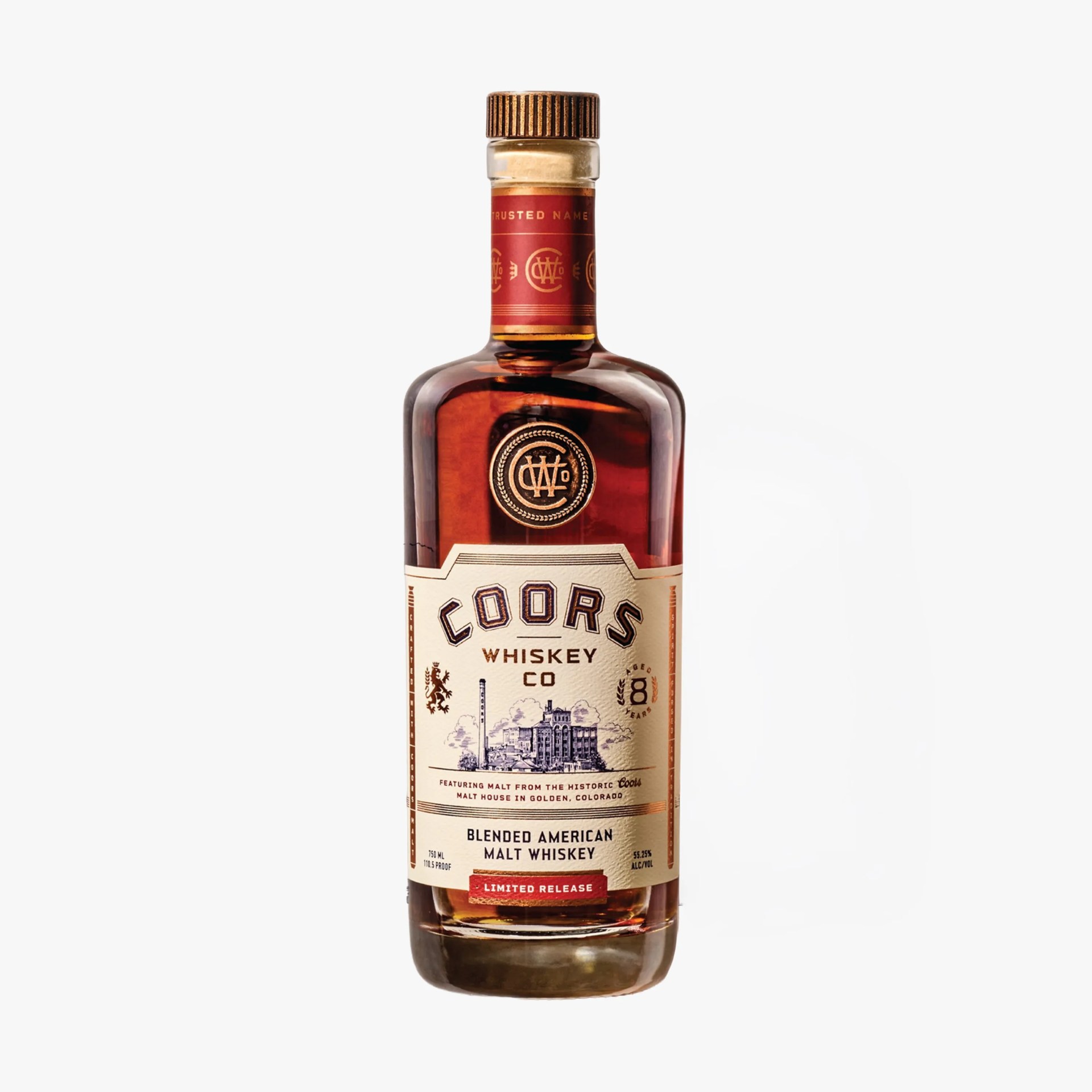 Brown glass bottle of Coors Whiskey Co blended American malt whiskey with a beige label and red cap.