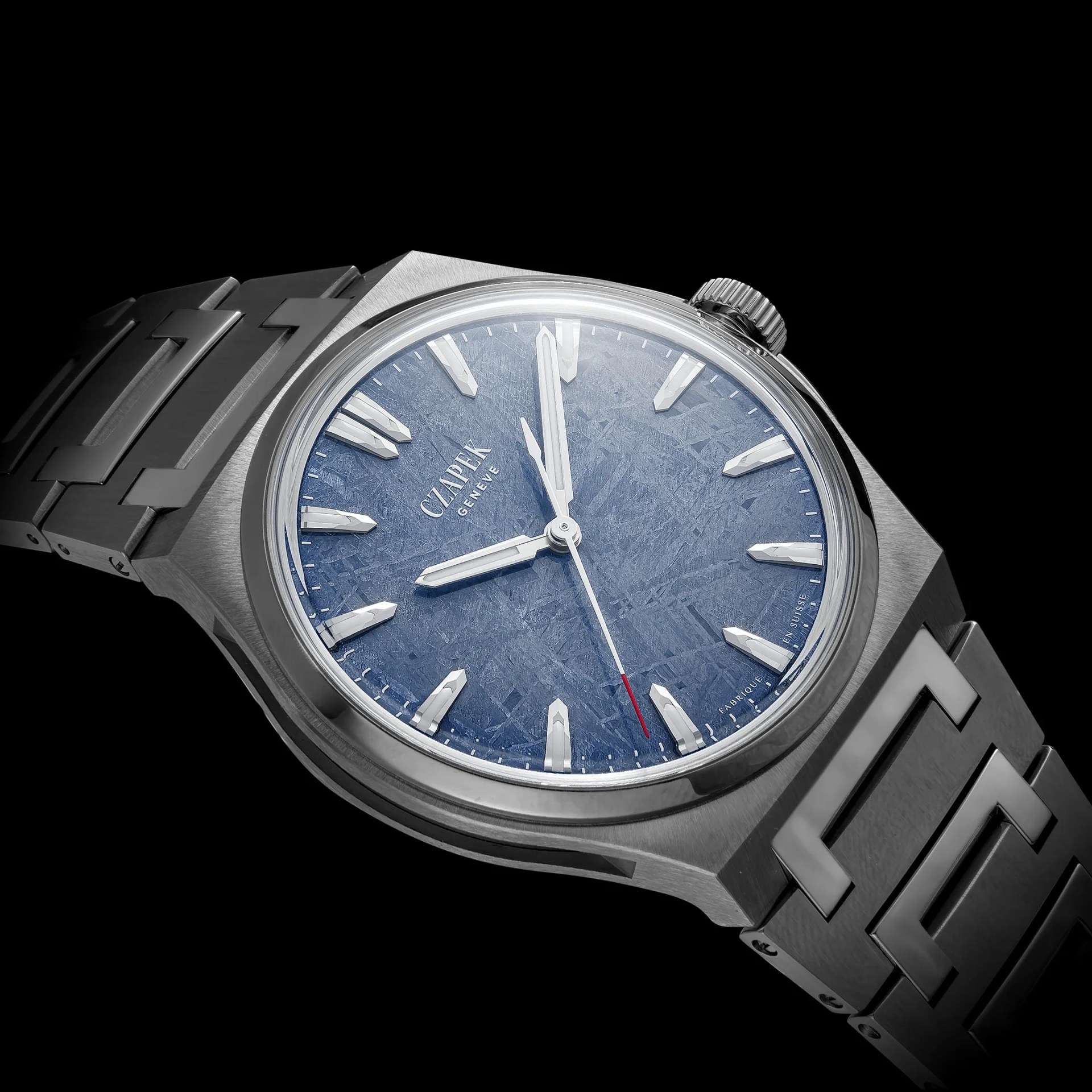 Stainless steel wristwatch with a textured blue dial, silver hour markers, and a linked metal bracelet.