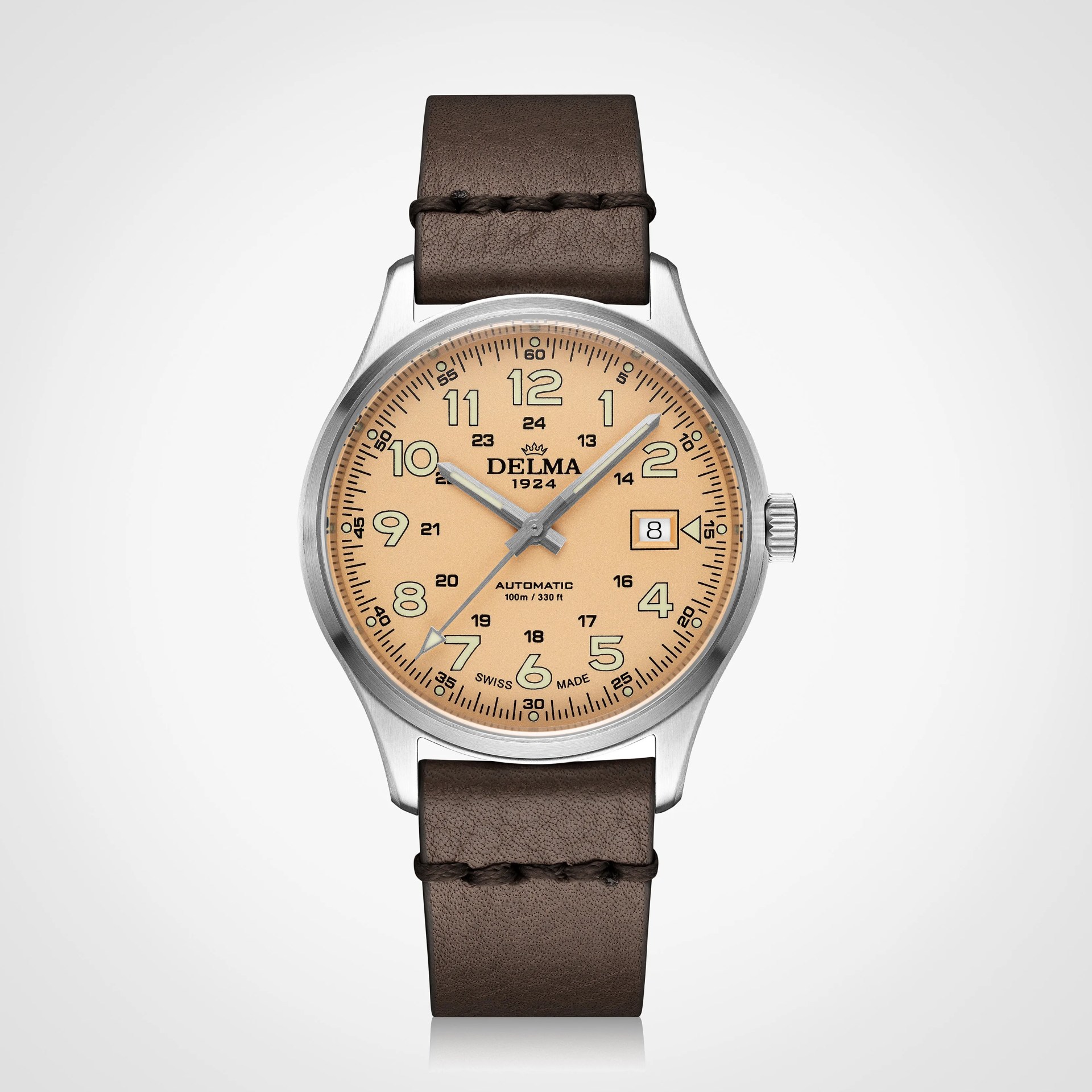 Round silver stainless steel watch with beige dial, black numerals, date window, and brown leather strap.