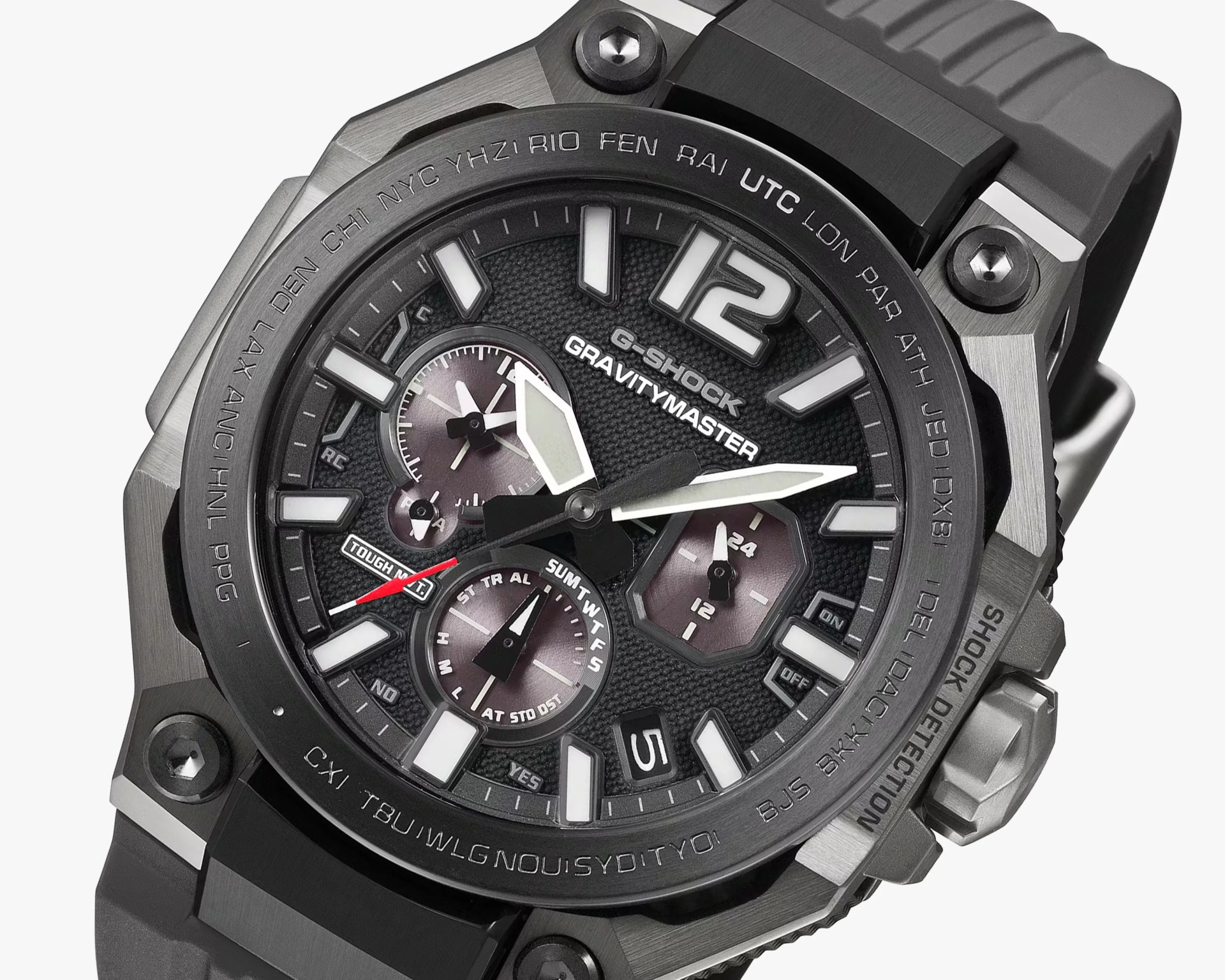 Close-up of a black G-Shock Gravitymaster watch face with white markers, subdials, and a gray strap.