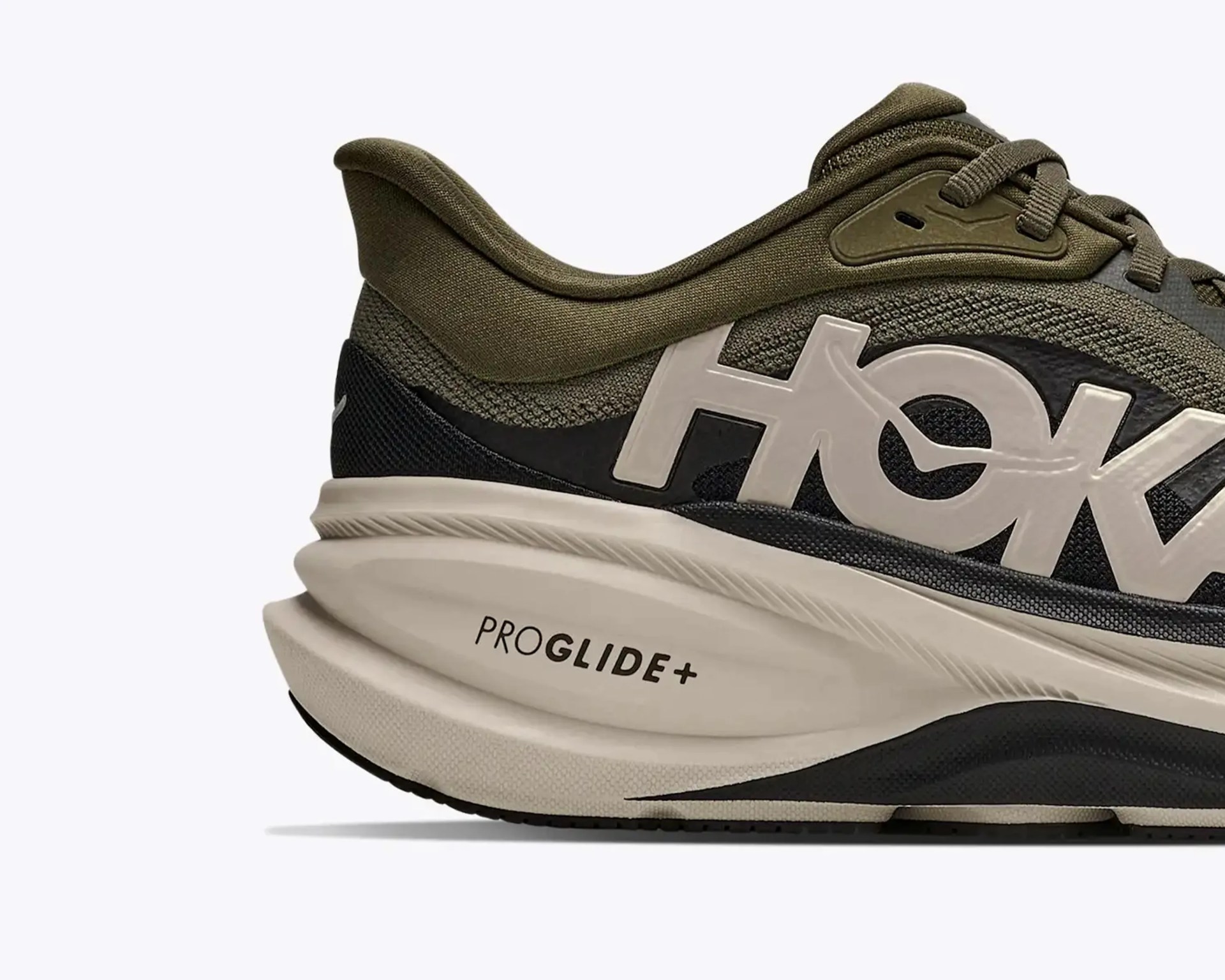 Close-up of olive green and black HOKA running shoe with white midsole labeled "PROGLIDE+