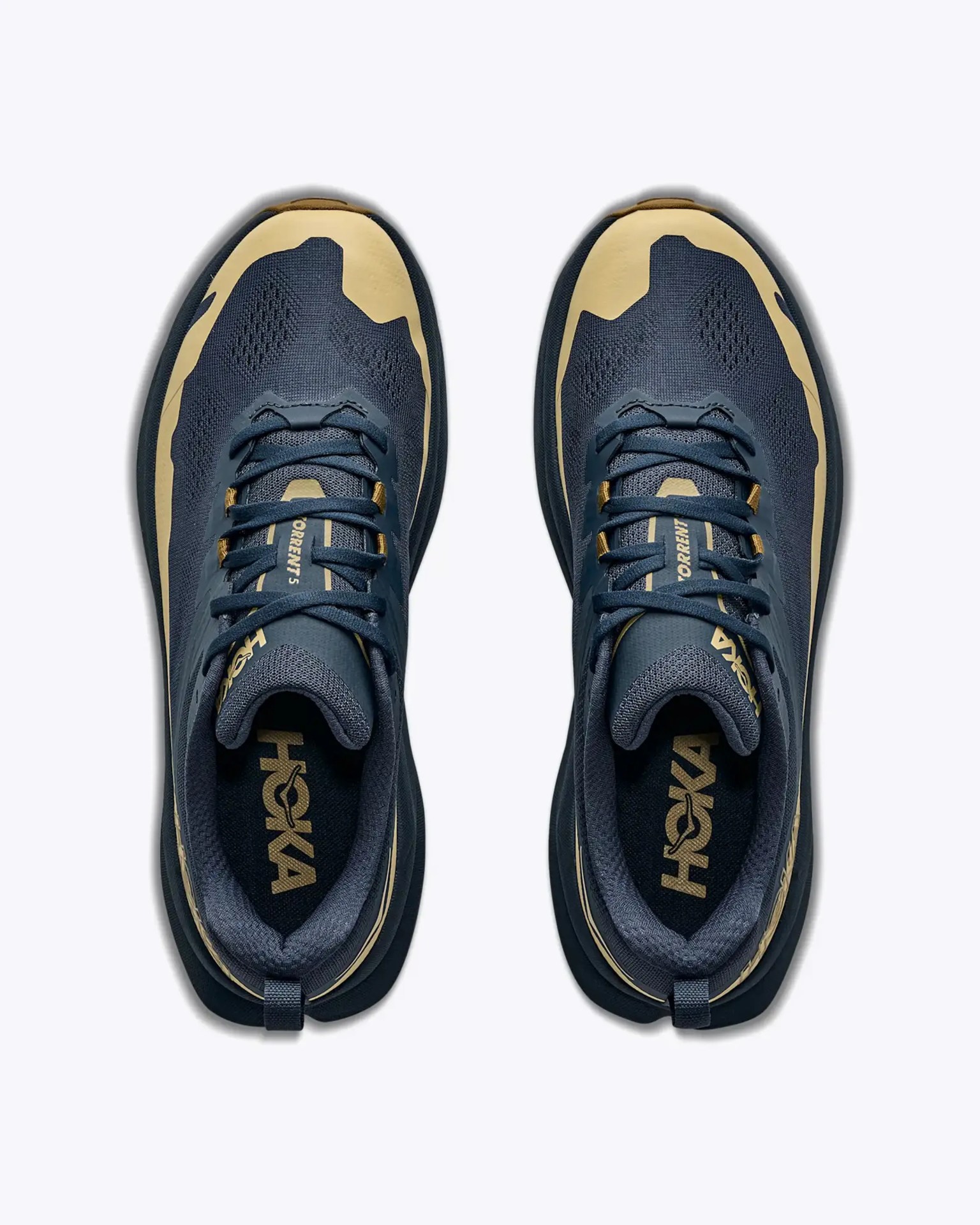 Pair of navy blue and tan Hoka running shoes viewed from above on a white background.