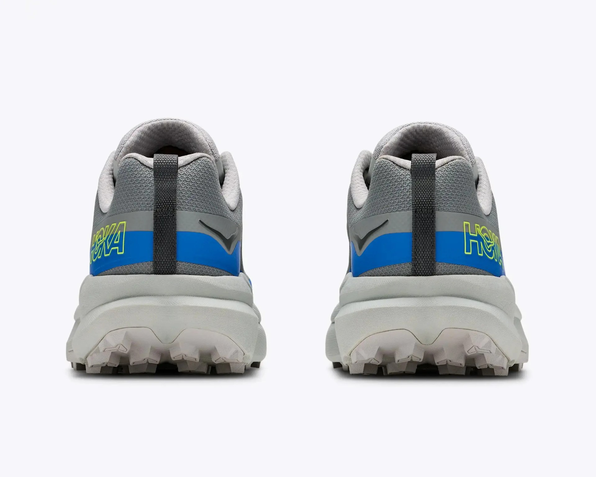 Pair of gray and blue athletic shoes with thick white soles viewed from the back.