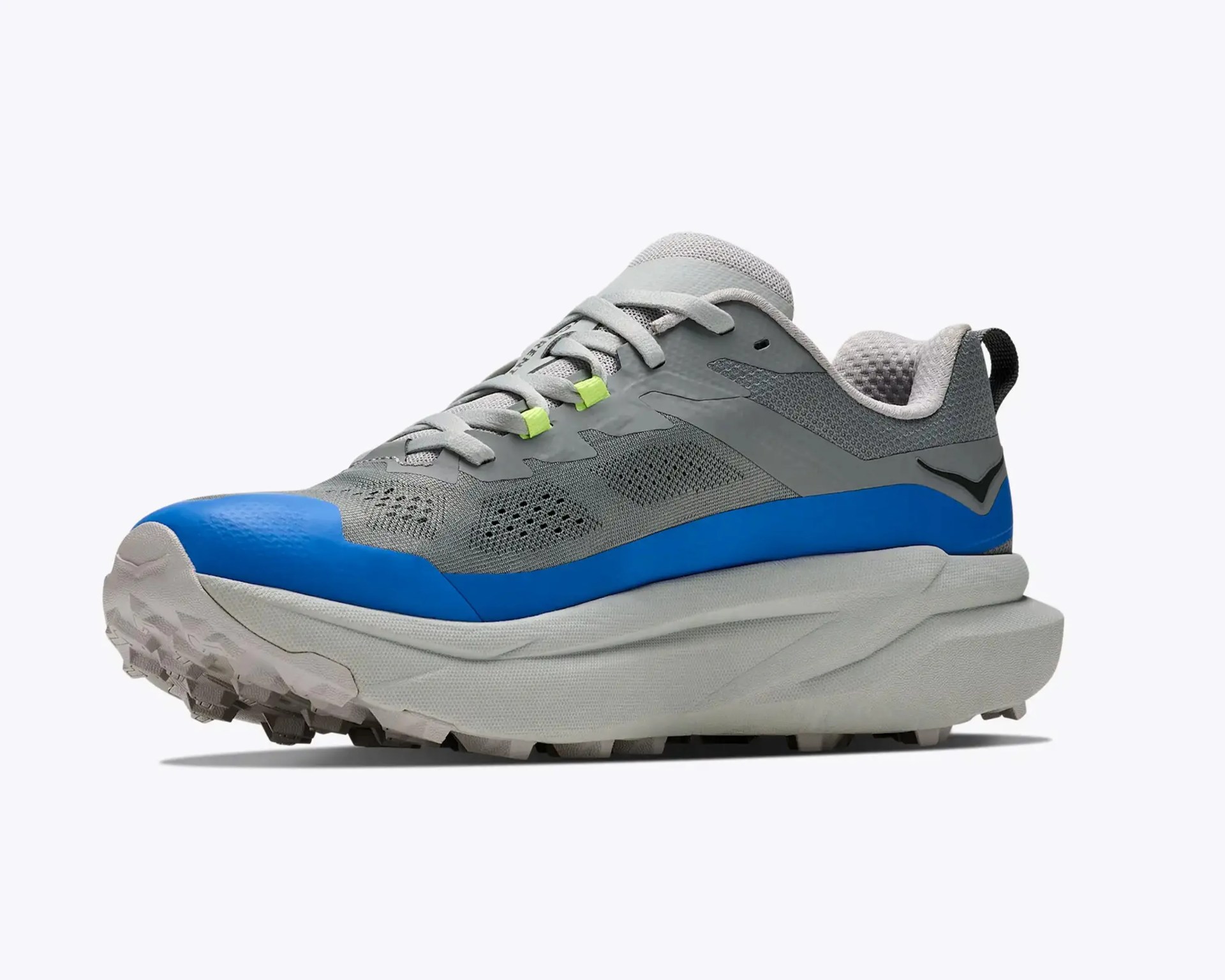 Gray and blue athletic shoe with thick white sole and neon green lace loops.