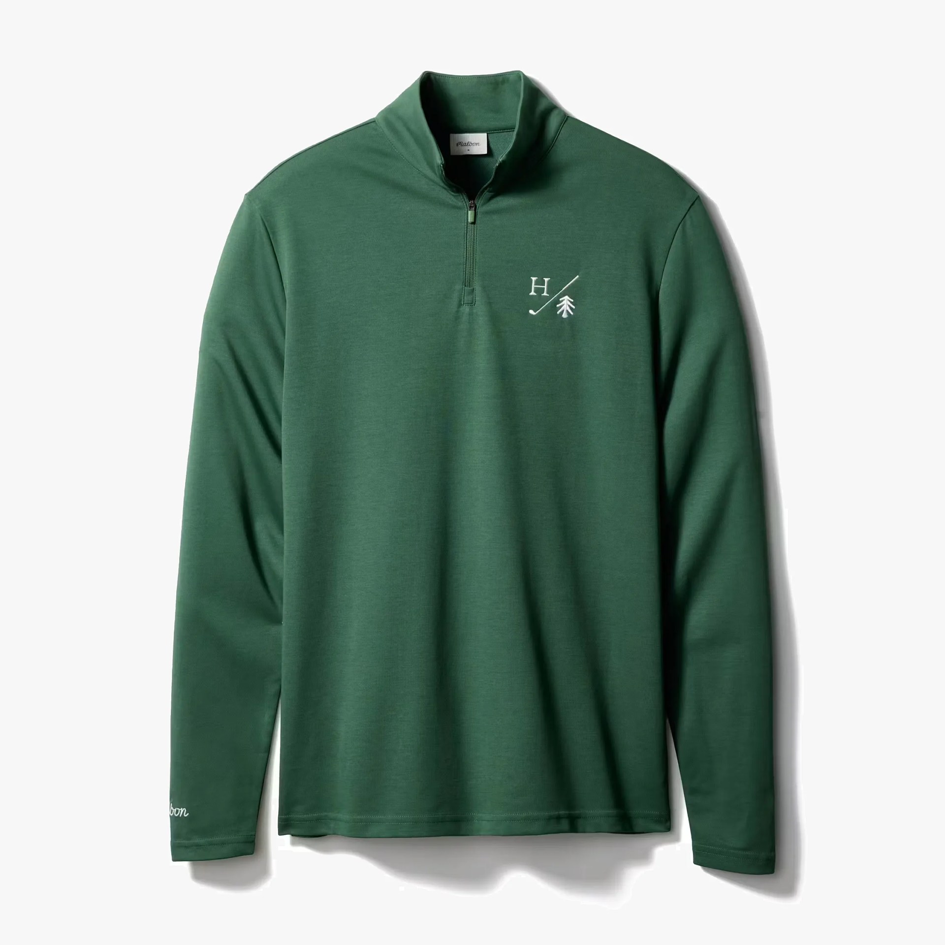 Green quarter-zip pullover with white "H" and tree logo on the chest and script on the sleeve.
