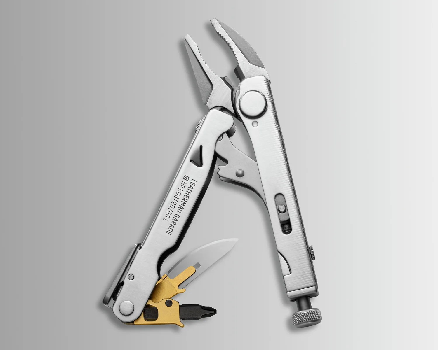 Silver Leatherman Garage multi-tool with pliers, knife blade, and screwdriver bits on a gray background.