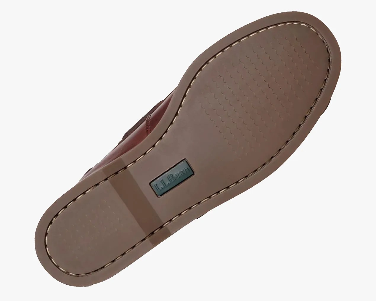 Brown rubber sole of a shoe with L.L.Bean logo and stitched edge.