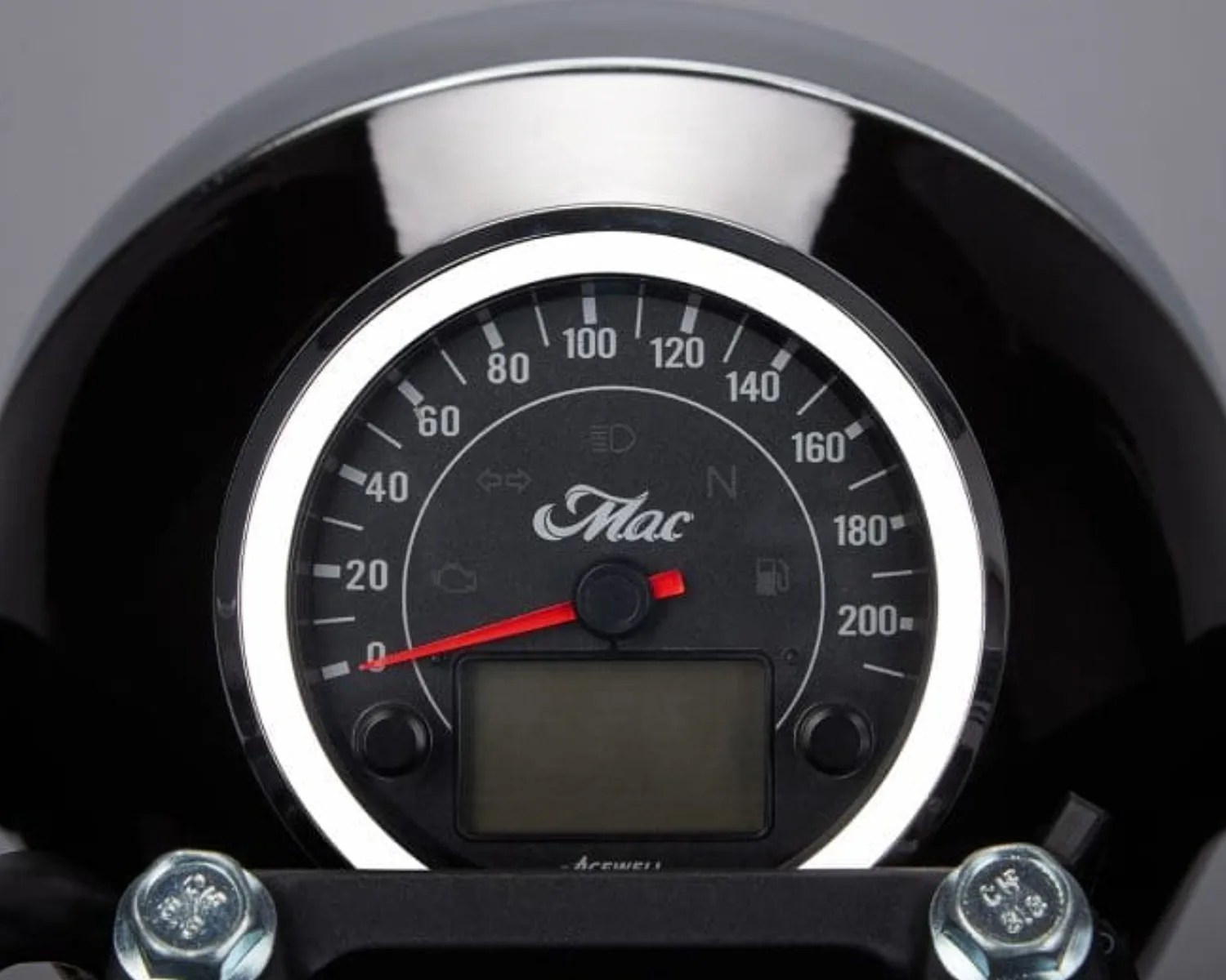 Round black motorcycle speedometer with white markings, red needle, and digital display below the center.