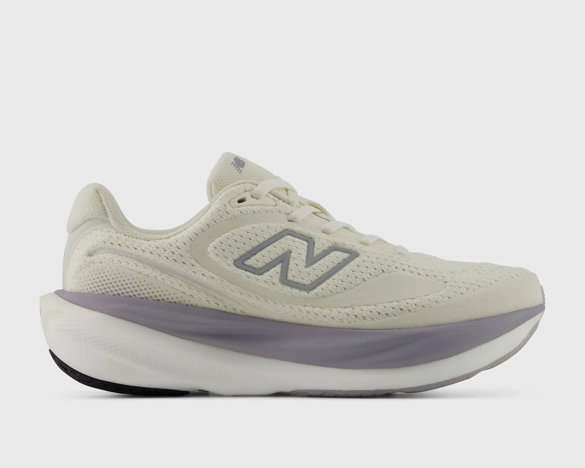 Off-white New Balance running shoe with mesh upper and gray cushioned sole.