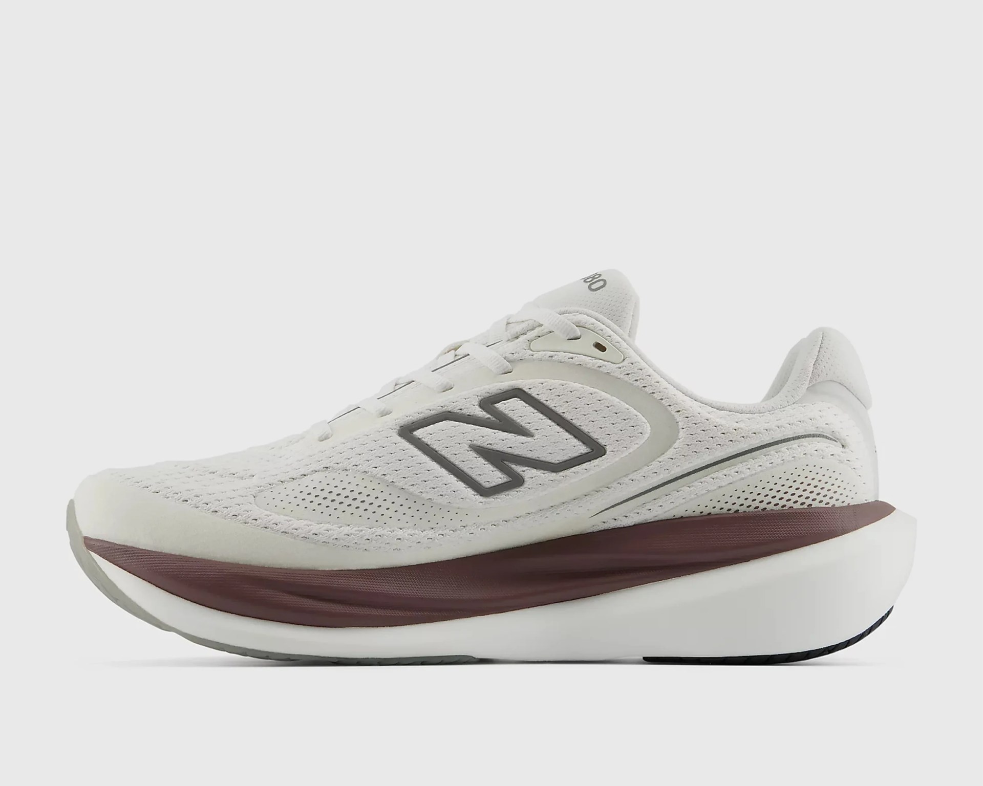 White New Balance running shoe with gray "N" logo and maroon midsole.