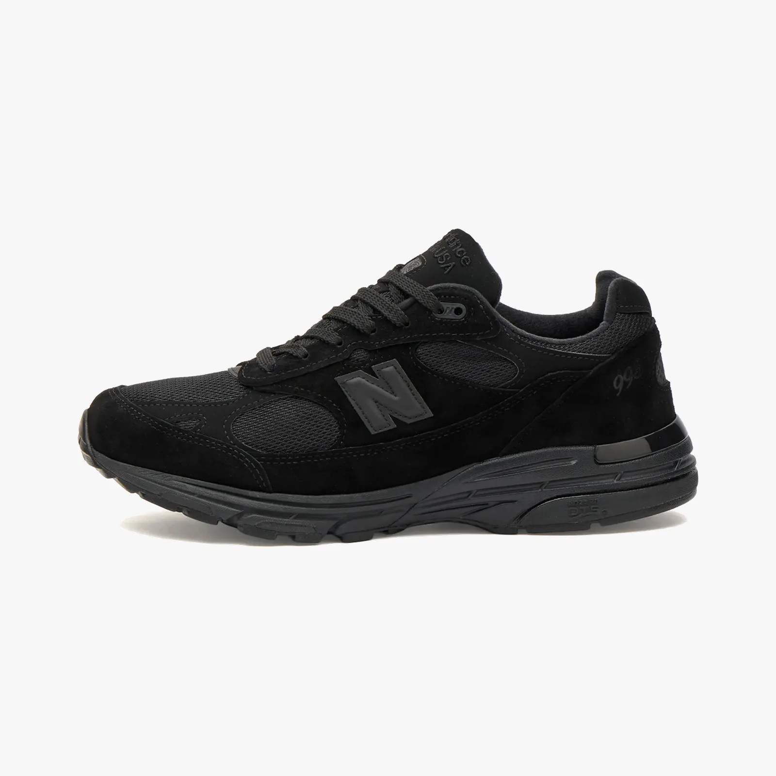 Black New Balance 998 sneaker with suede and mesh upper and thick rubber sole.