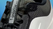 Close-up of a black Nike Pegasus Premium sneaker with textured upper and white midsole.
