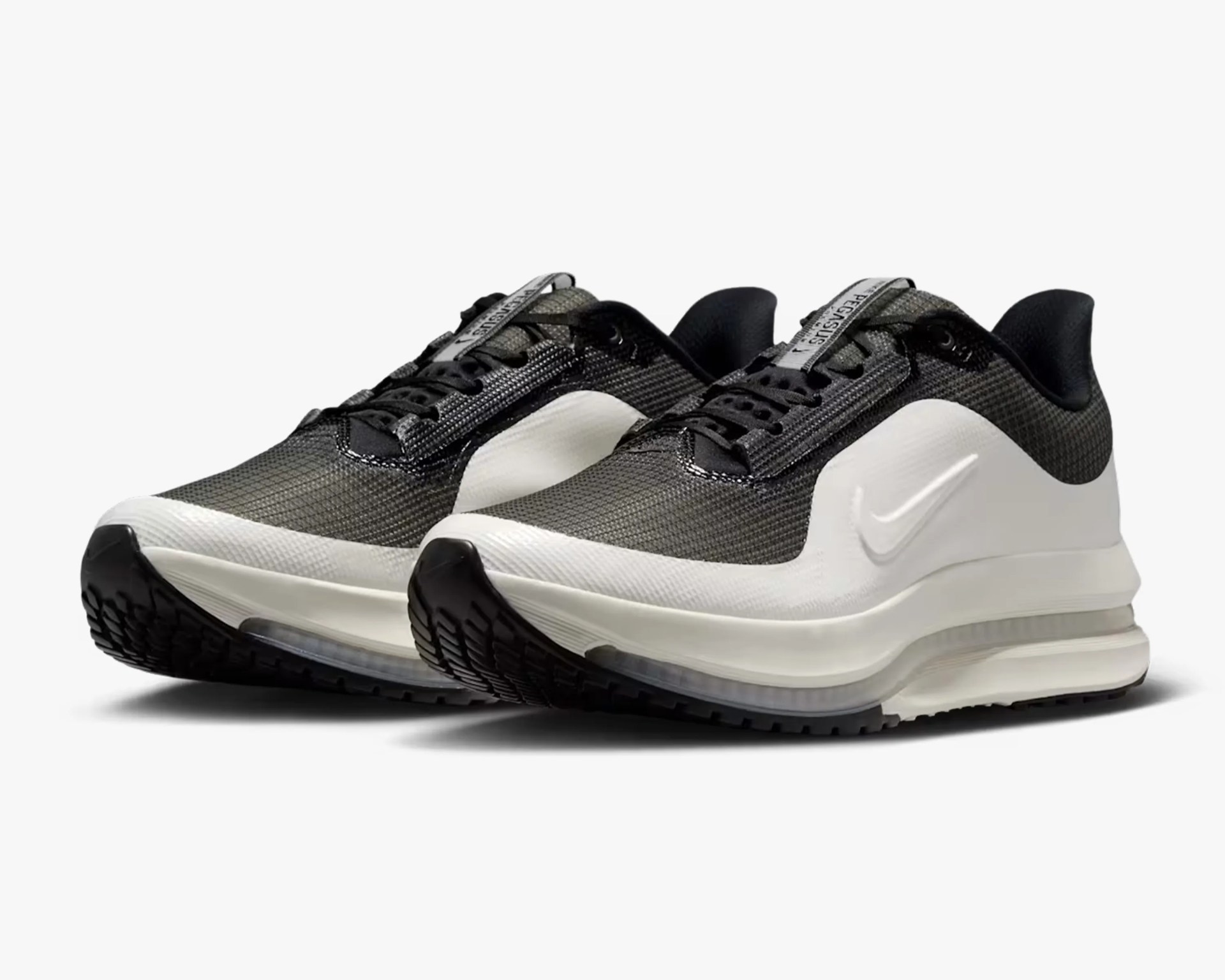 Pair of black and white Nike Air Max sneakers with mesh upper and visible air cushion sole.