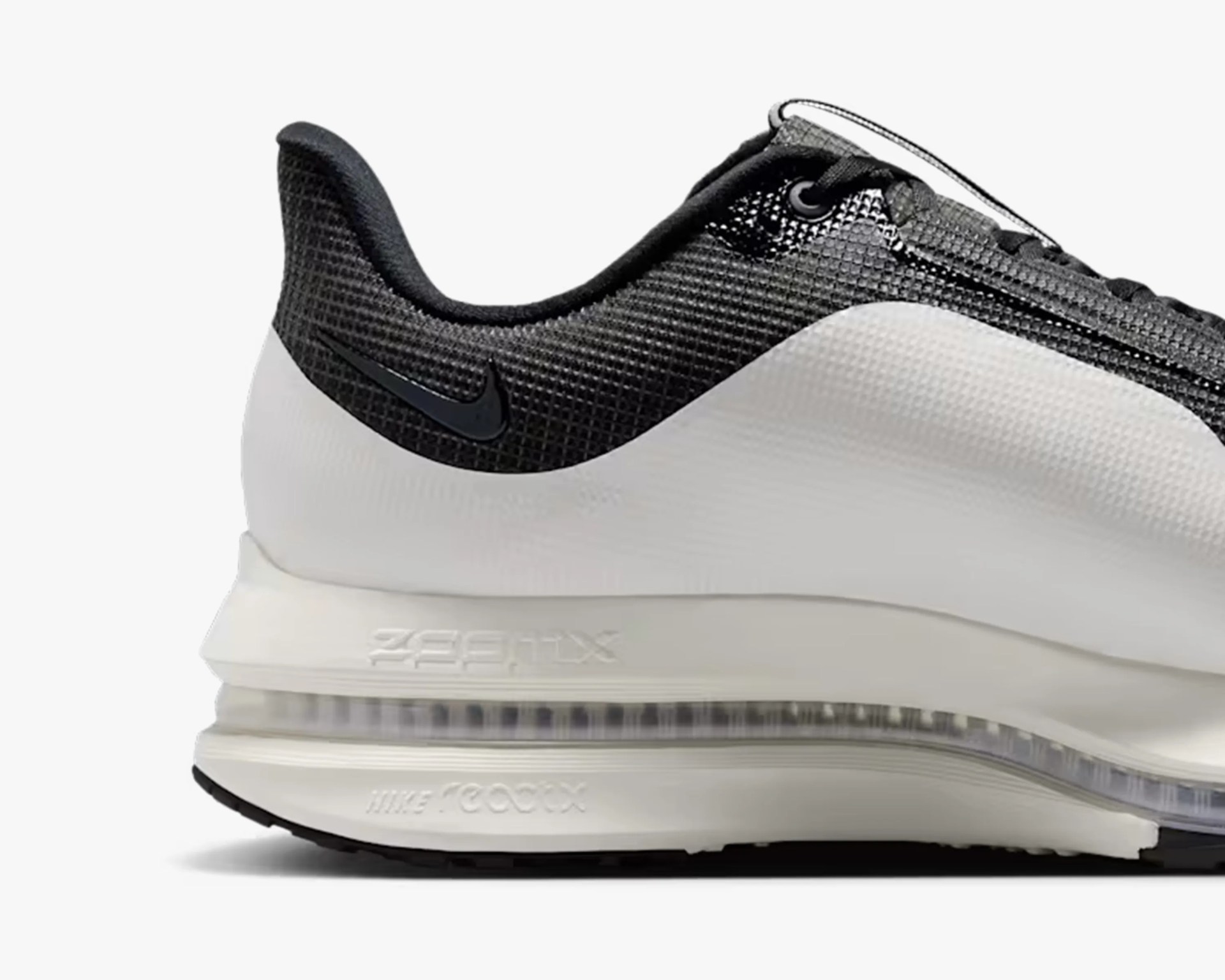 White and black Nike Air Max sneaker heel with visible air cushion and textured upper.
