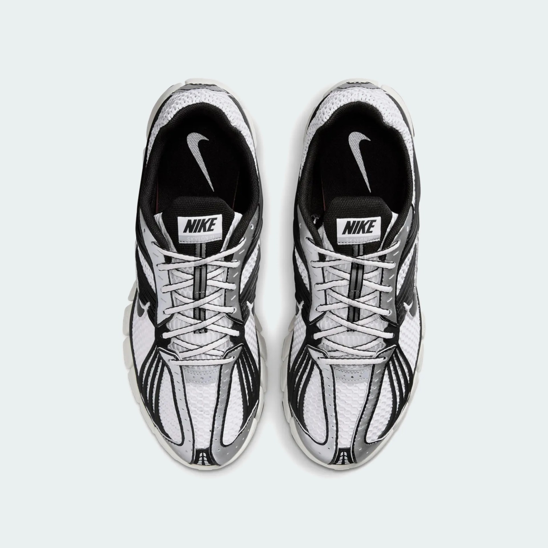 Pair of white and black Nike Skylon II sneakers viewed from above on a light background.