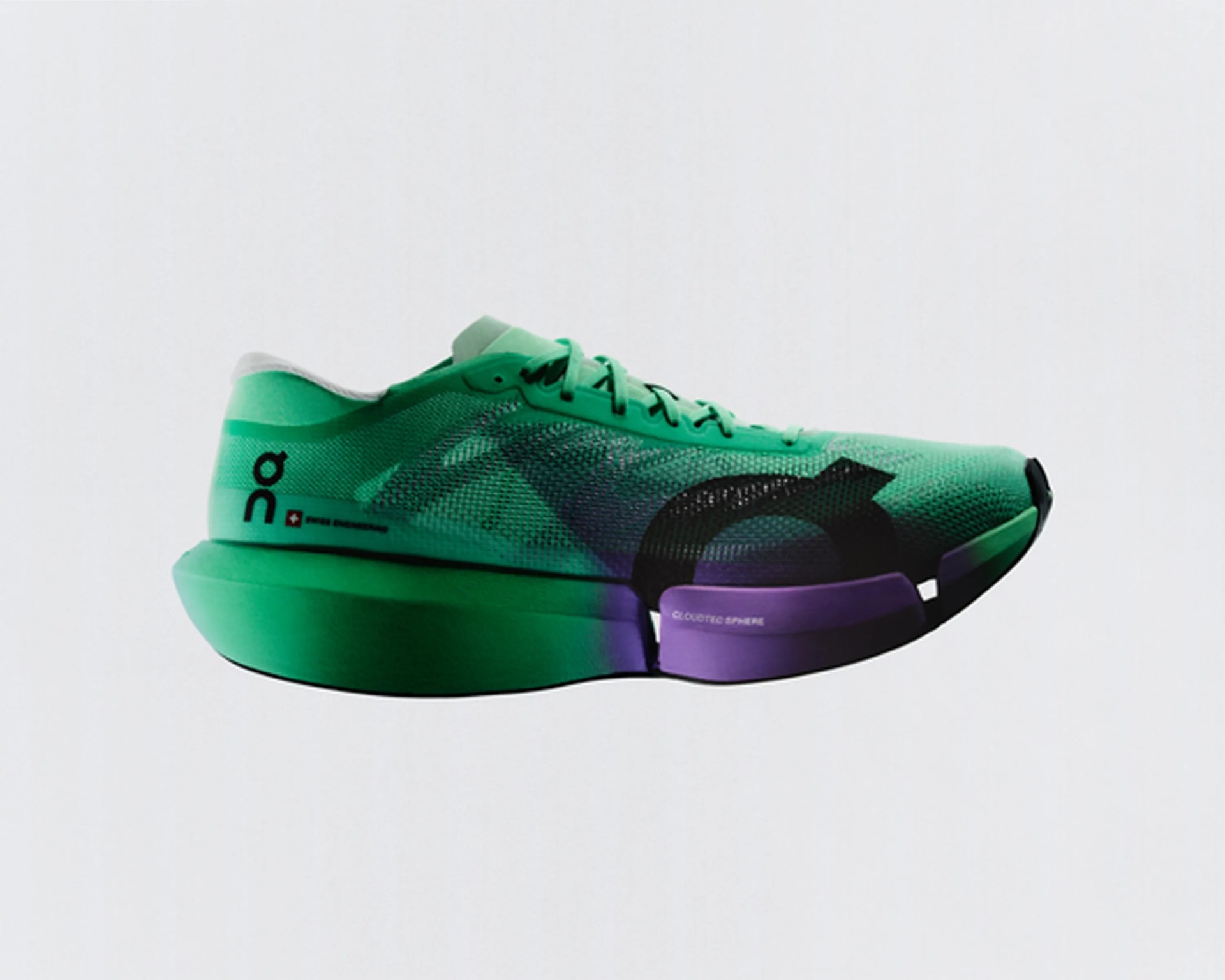 Green and purple On running shoe with mesh upper and thick sole labeled "Cloudtec Sphere.
