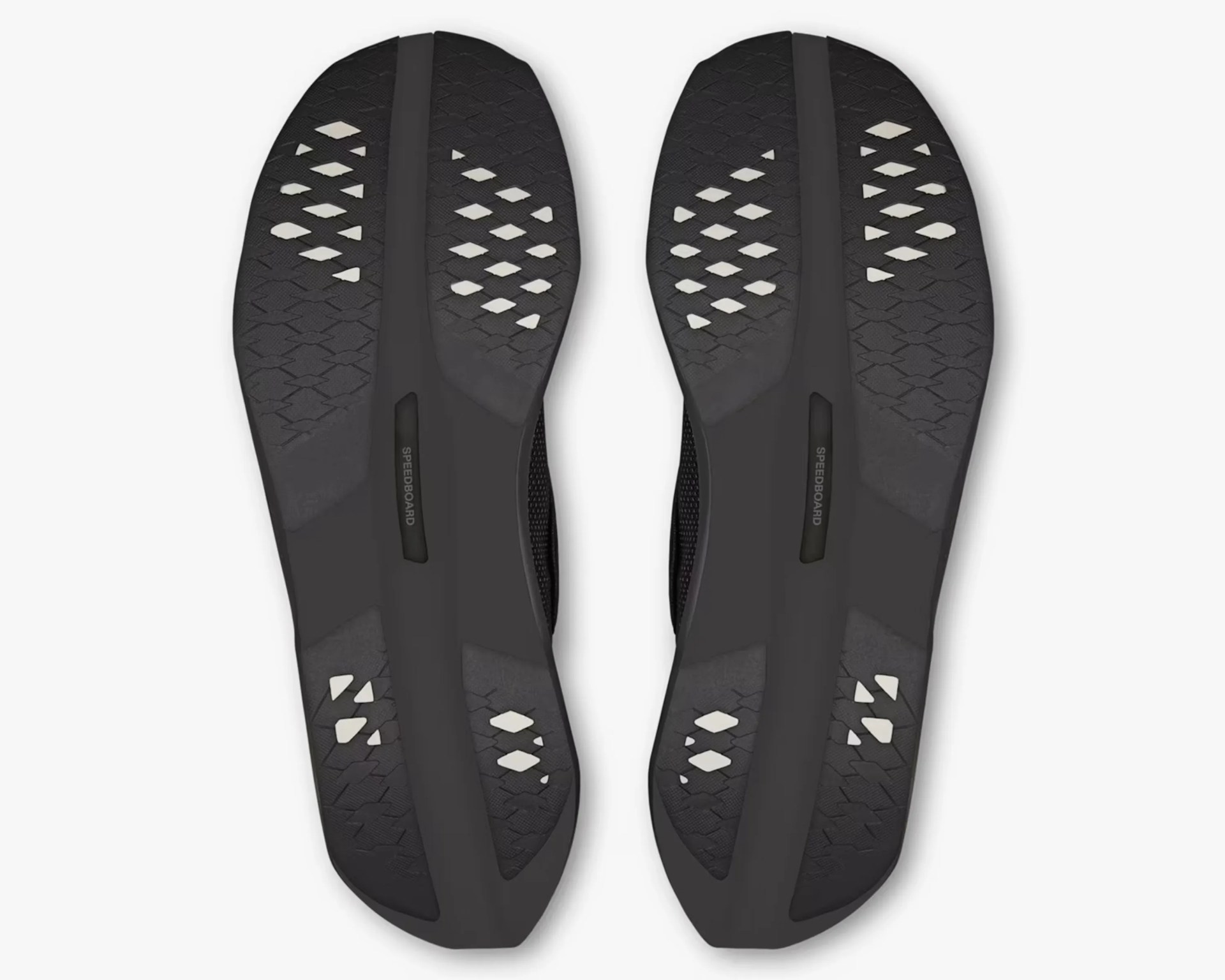Black shoe soles with diamond-shaped white grip patterns and "SPEEDBOARD" text in the center.