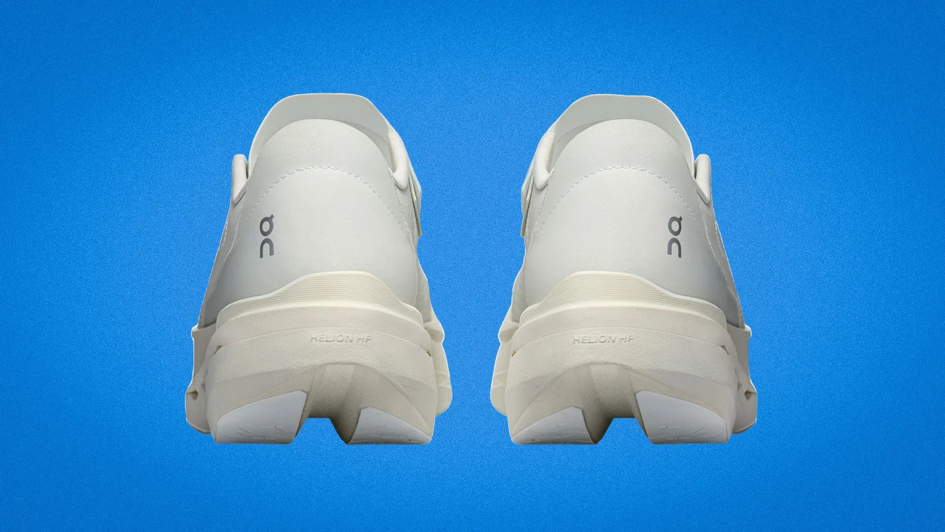 Pair of off-white On running shoes viewed from the back against a blue background.
