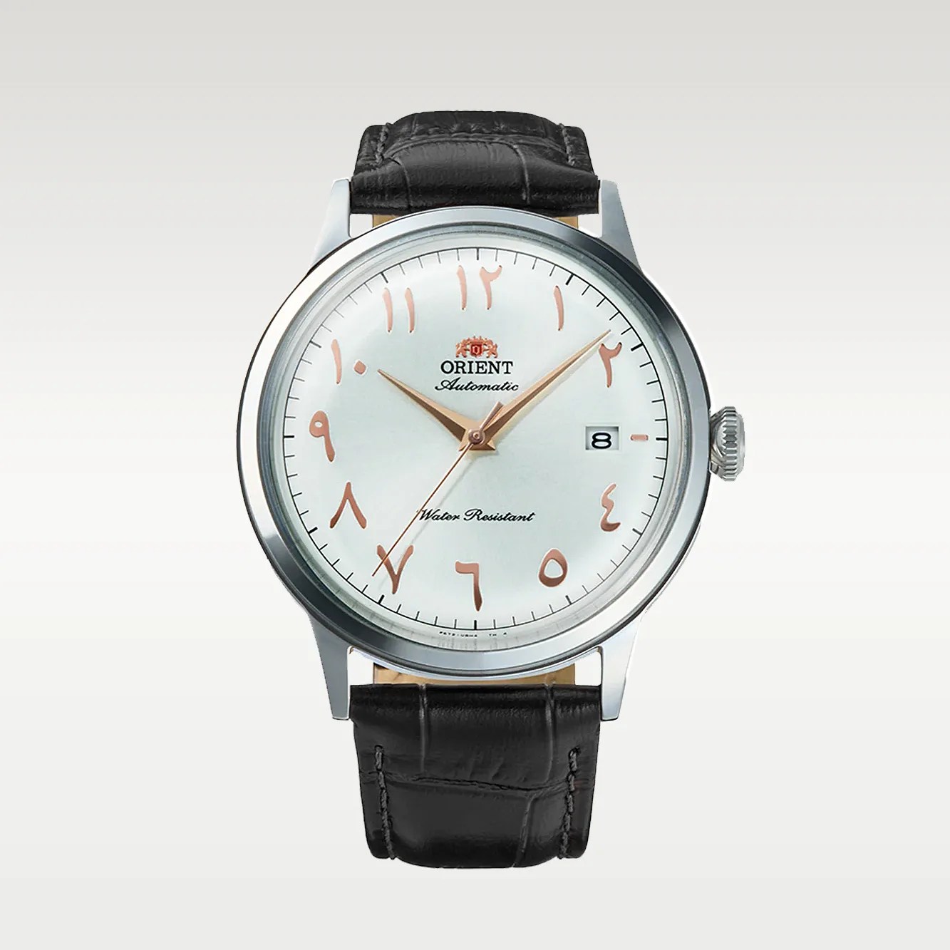 Silver Orient automatic wristwatch with rose gold Arabic numerals and black leather strap.