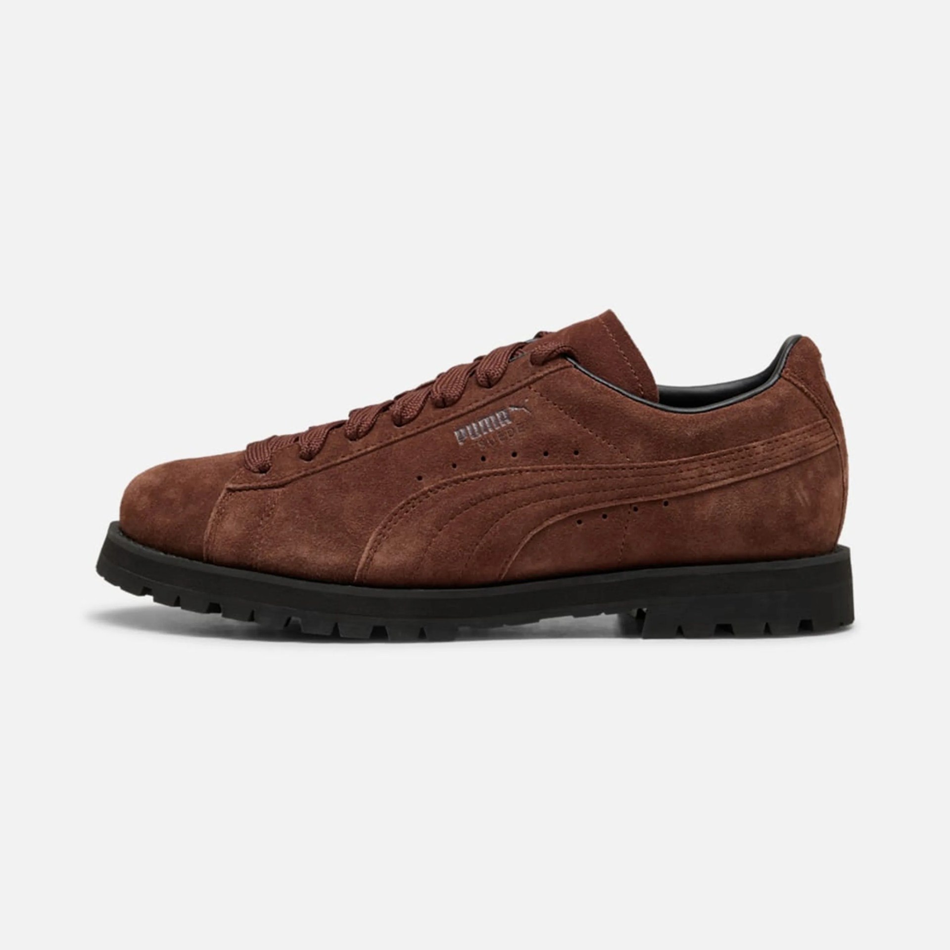 Brown suede Puma Suede sneaker with black sole and brown laces.