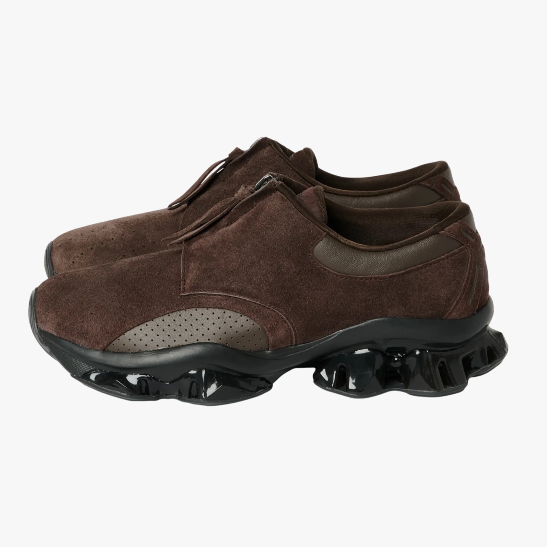 Dark brown suede sneakers with perforated leather side panels and glossy black sculpted soles.