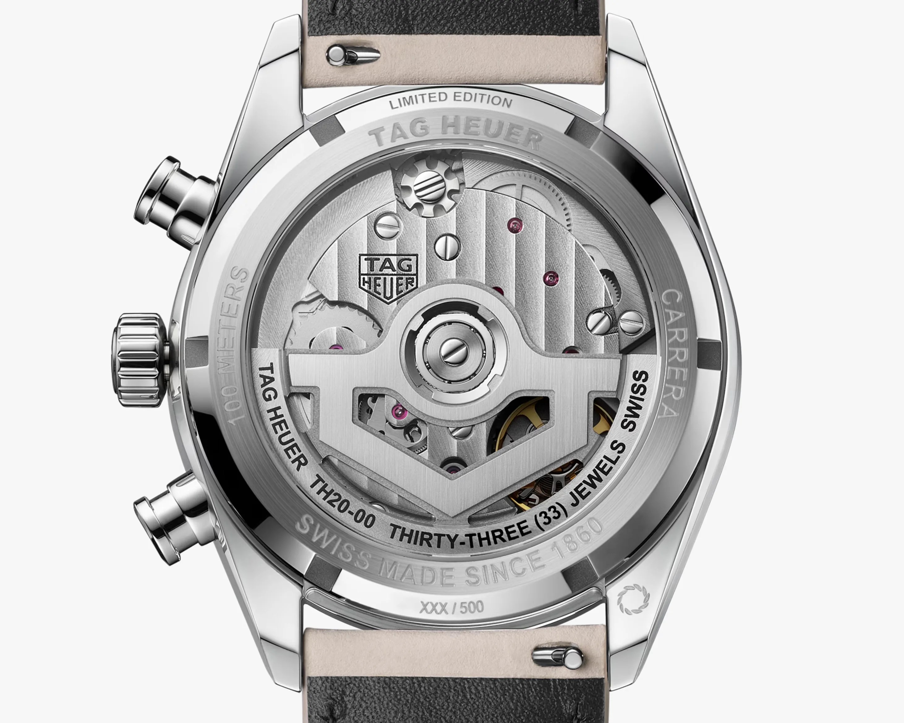 Close-up of the back of a TAG Heuer Carrera watch showing the intricate silver mechanical movement with visible gears and the engraved text "LIMITED EDITION," "TAG HEUER," and "THIRTY-THREE (33) JEWELS.