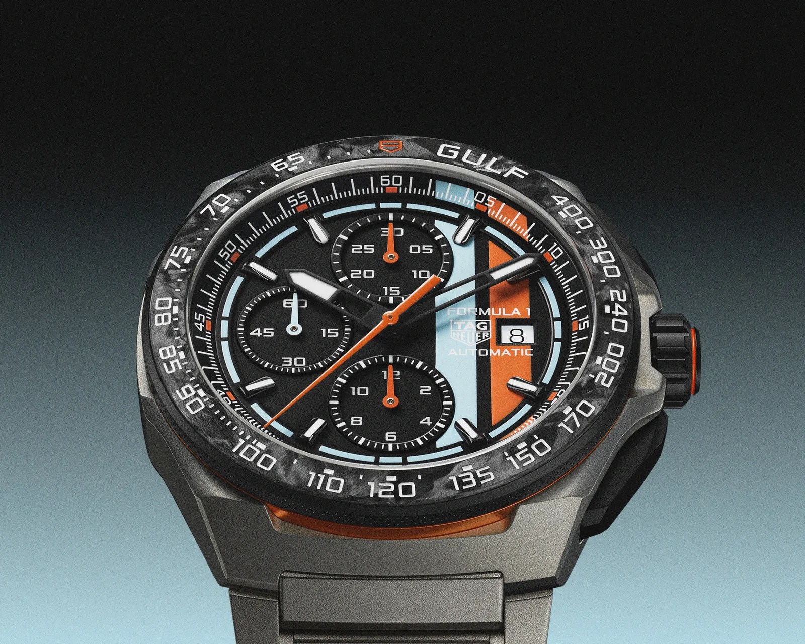 Black TAG Heuer Formula 1 Gulf automatic chronograph watch with orange and light blue accents and black strap.