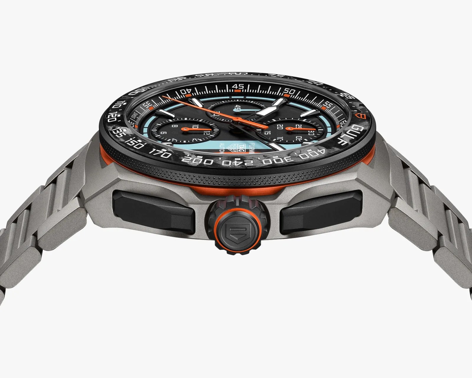 Titanium TAG Heuer Gulf chronograph watch with black and light blue dial, orange accents, and metal bracelet.