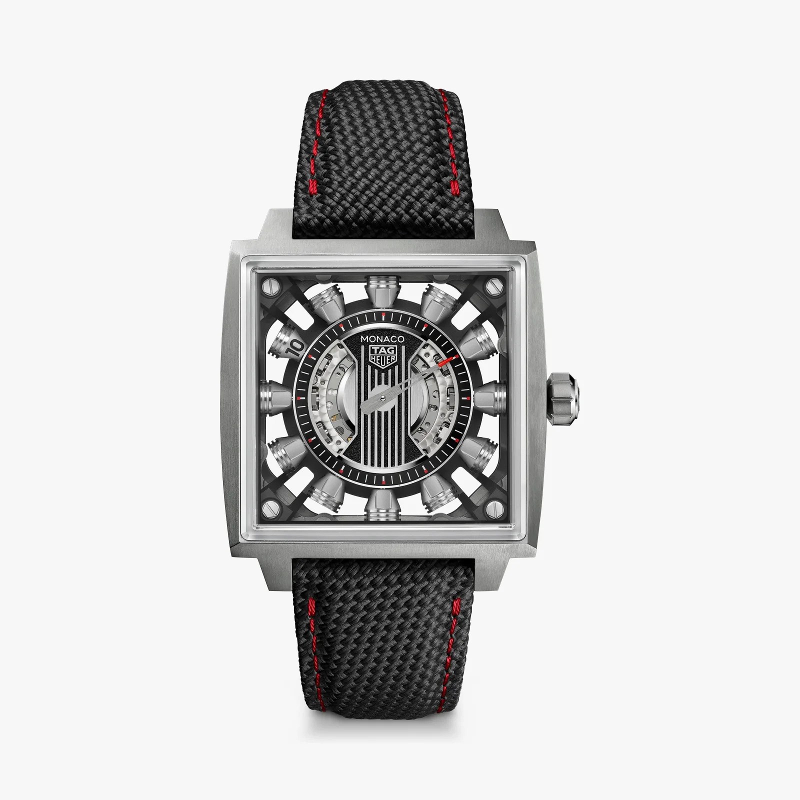 Square TAG Heuer Monaco watch with a black textured dial, silver accents, and black strap with red stitching.