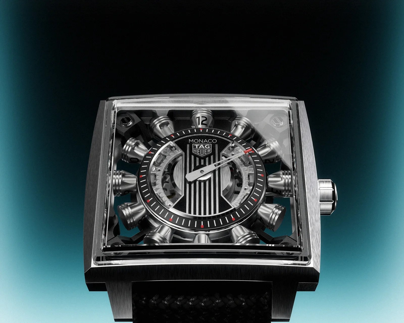 Square TAG Heuer Monaco wristwatch with a transparent dial showcasing mechanical components and a black strap.