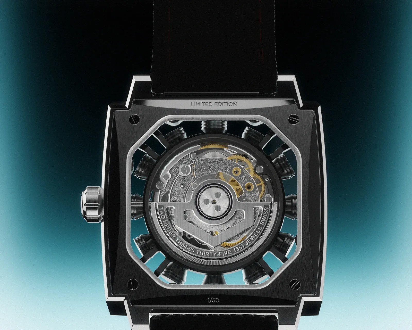 Close-up of the back of a TAG Heuer limited edition watch showing the intricate mechanical movement and engraved details.
