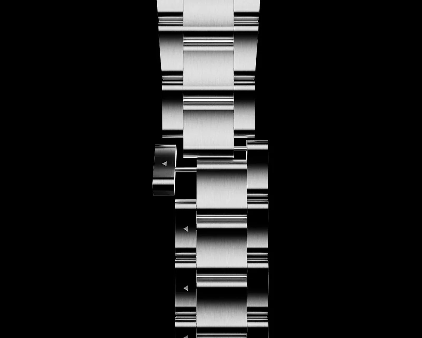 Brushed titanium watch bracelet with a partially extended link mechanism on a black background.