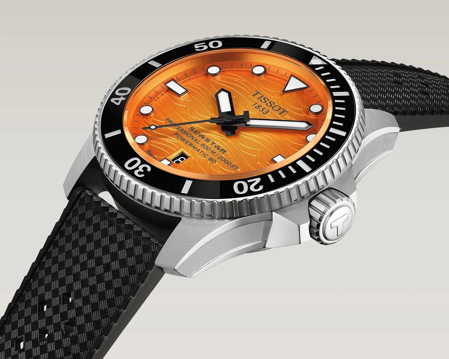 Diver watch with orange textured dial, black bezel, silver case, and black textured strap.