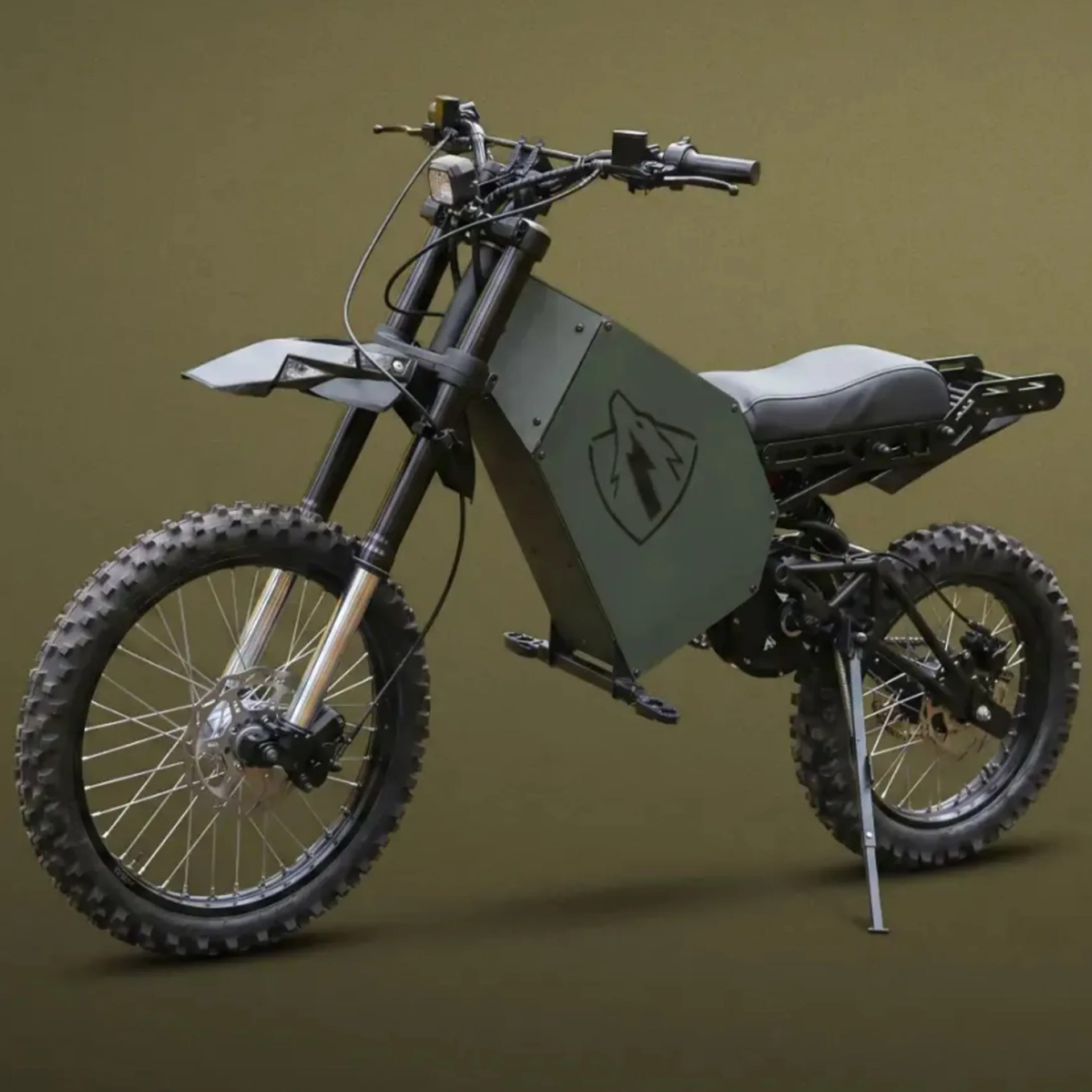 Off-road electric dirt bike with knobby tires, gray body panel featuring a wolf logo, and a white seat.