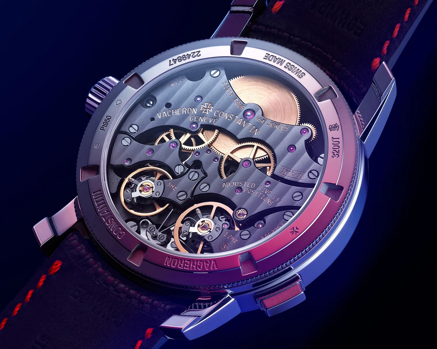 Close-up of the back of a Vacheron Constantin wristwatch showing intricate mechanical gears and components with a leather strap.