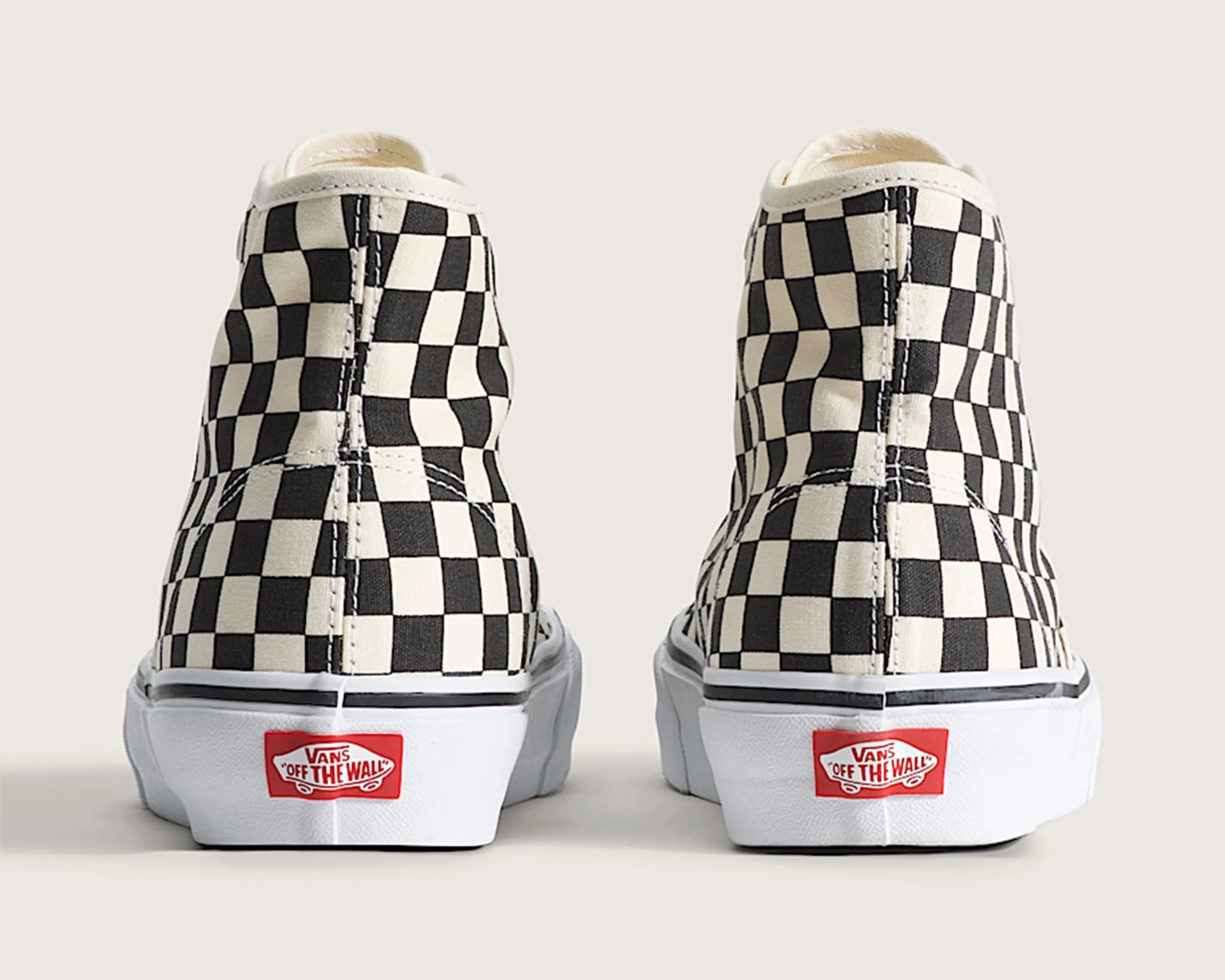 Pair of black and white checkered Vans high-top sneakers viewed from the back.
