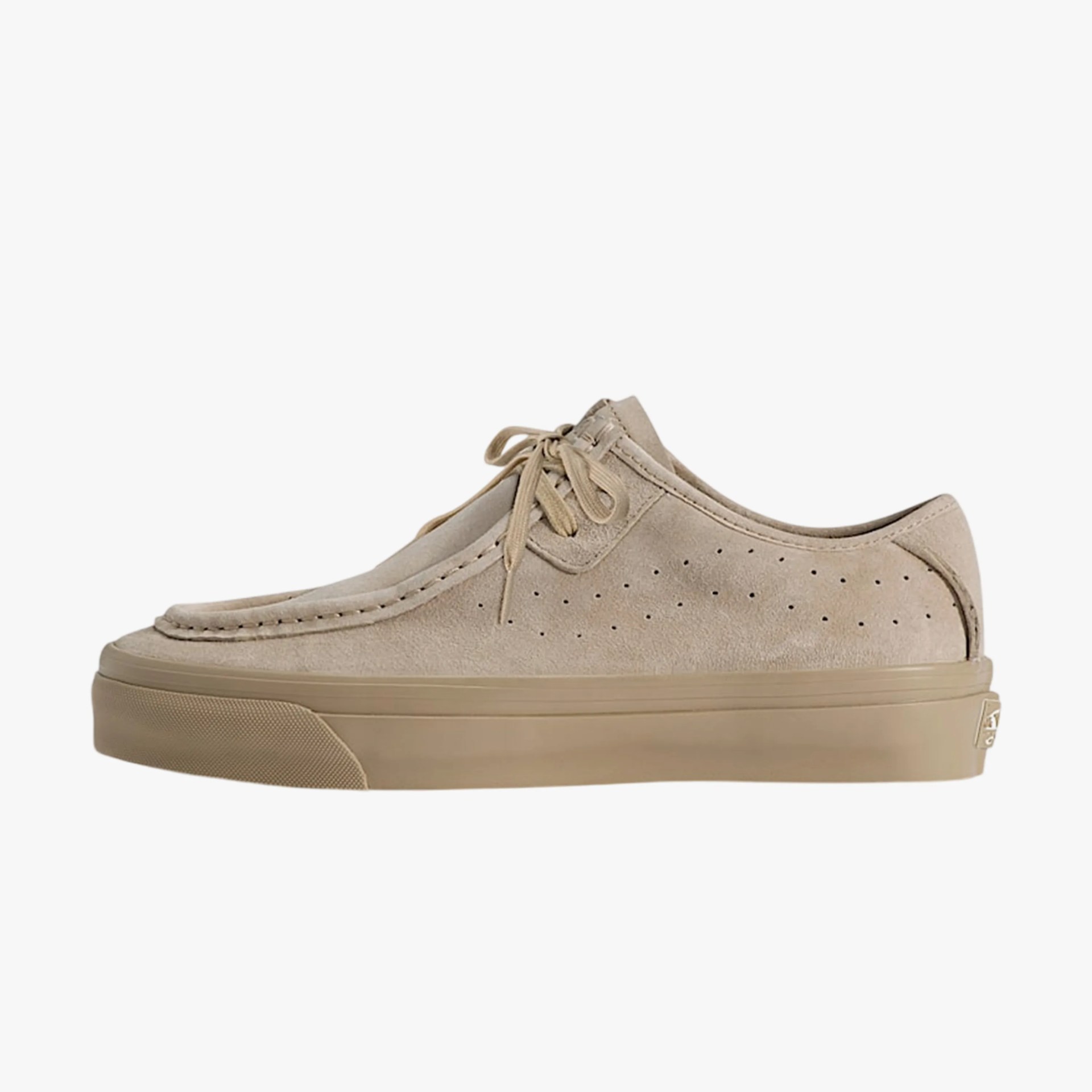 Beige suede lace-up shoe with perforated side panels and rubber sole.