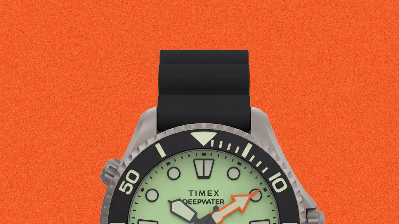 Timex Deepwater watch with black bezel, luminous green dial, and black rubber strap.