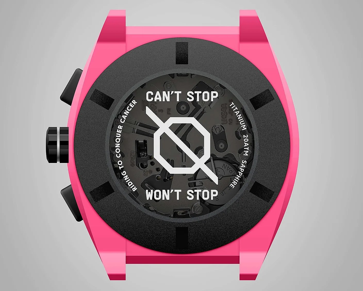Pink watch case with black bezel and transparent dial showing internal mechanics and text "CAN'T STOP WON'T STOP" and "RIDING TO CONQUER CANCER.
