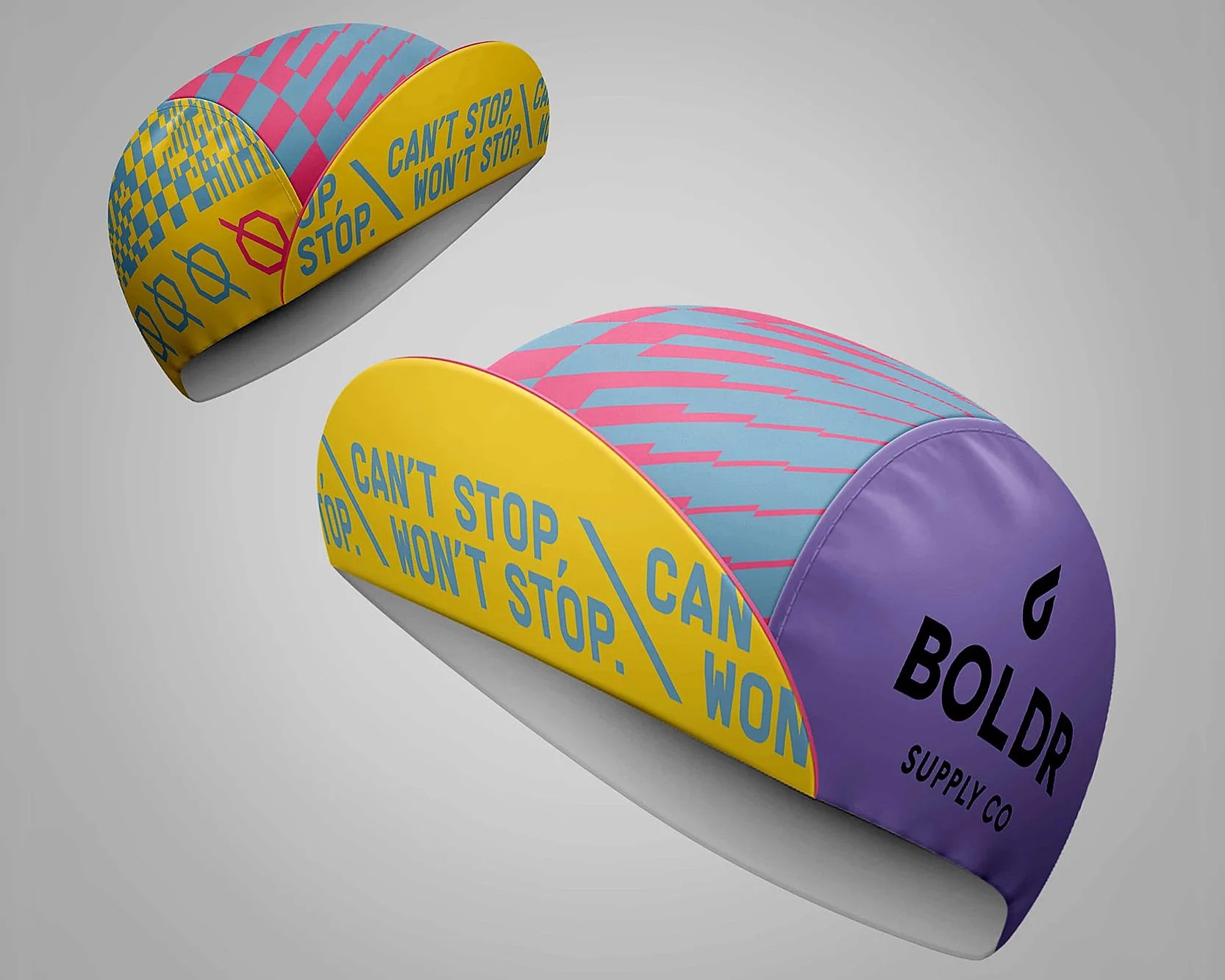 Two colorful cycling caps with yellow, purple, pink, and blue geometric patterns and text reading "CAN'T STOP, WON'T STOP" and "BOLDR SUPPLY CO.