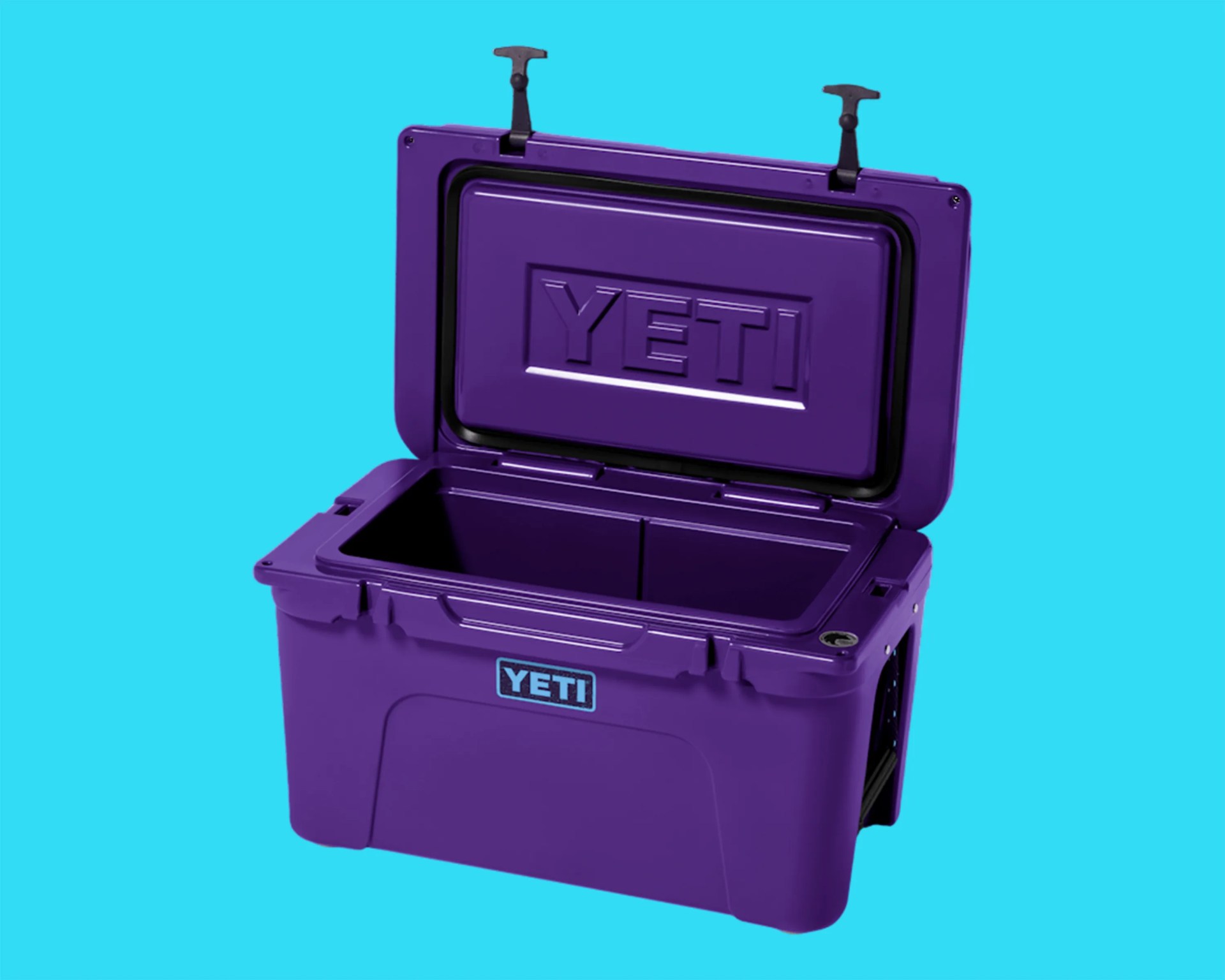 Purple YETI cooler with open lid against a bright blue background.