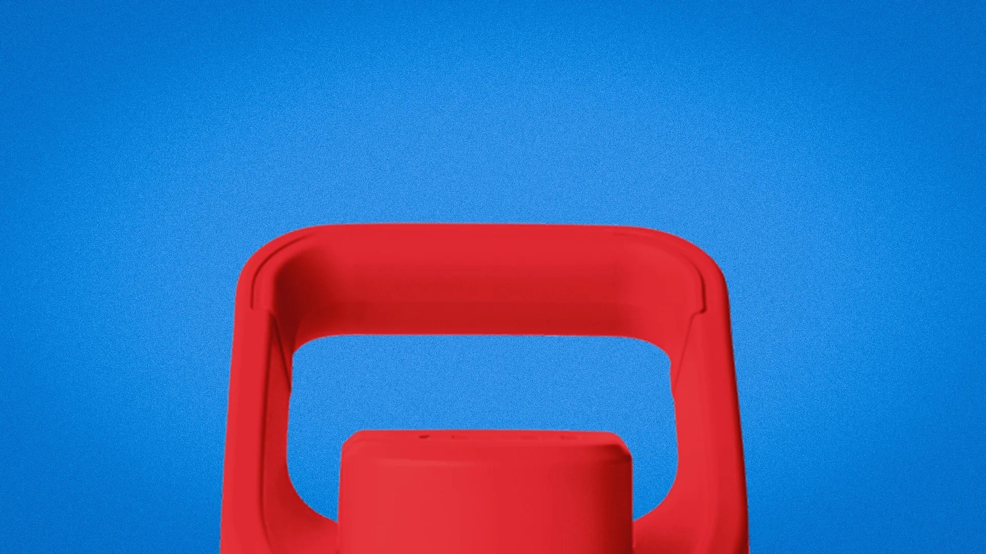 Close-up of a red plastic handle against a blue background.