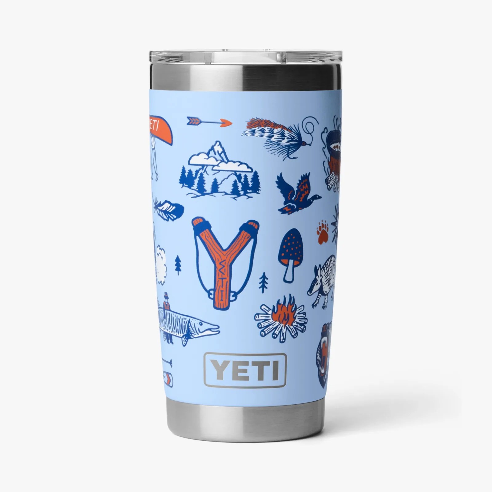 Light blue YETI tumbler with outdoor-themed illustrations including a slingshot, campfire, fish, and bird.