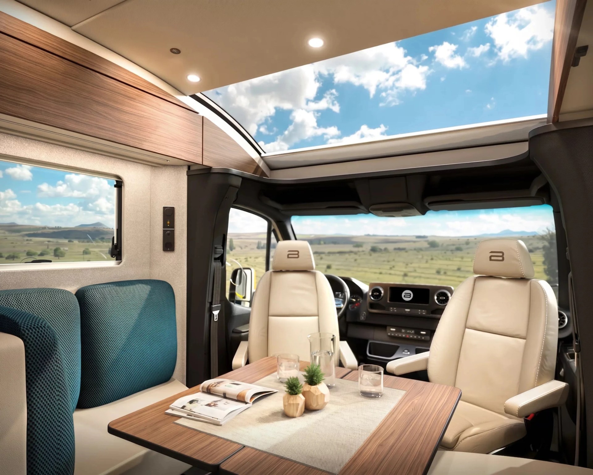 Interior of a camper van with beige leather seats, wooden table with magazines and plants, and a large skylight.