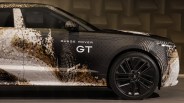 Side view of a Range Rover GT with a pixelated camouflage wrap and black alloy wheels.