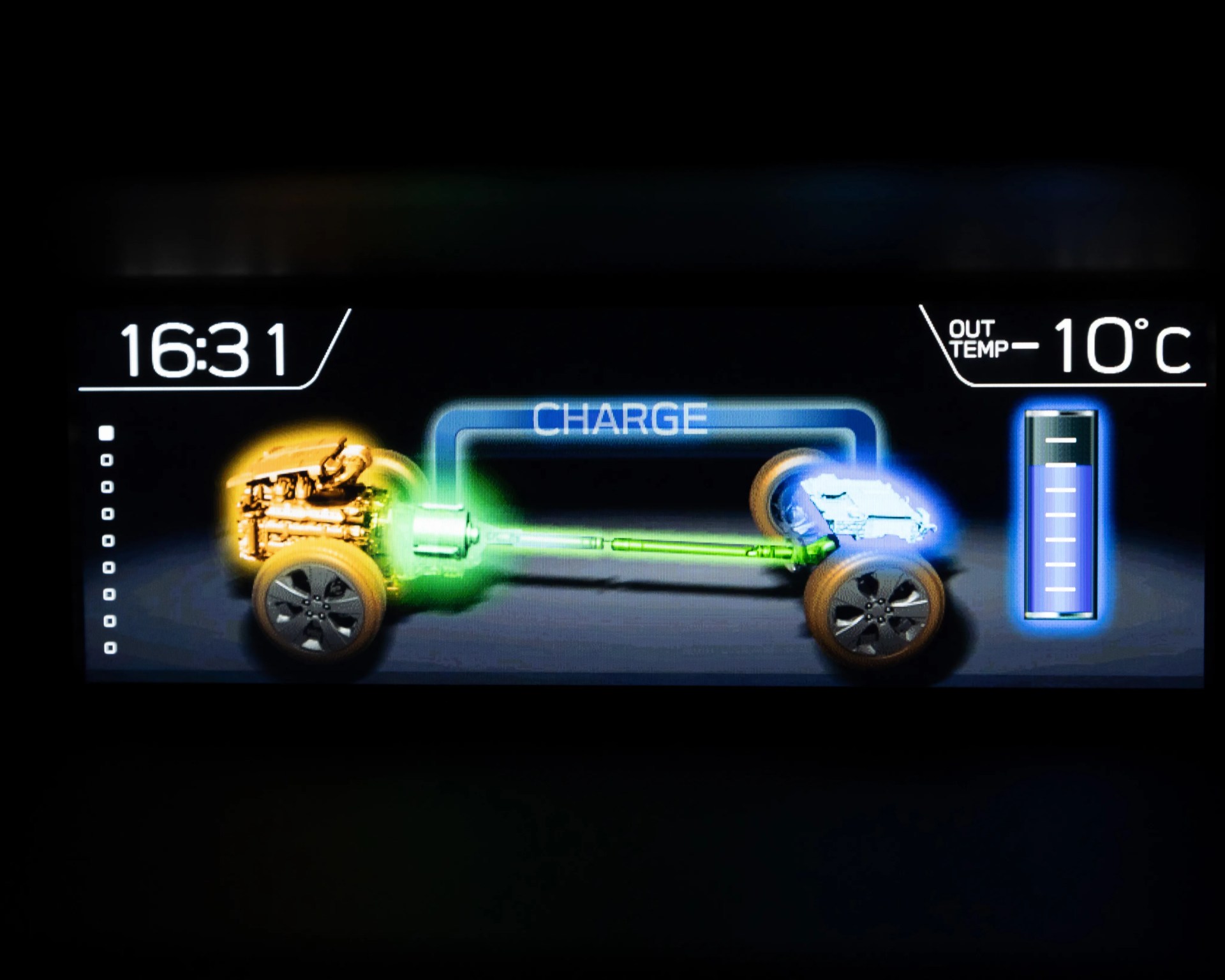 Car dashboard display showing hybrid system charging status, time 16:31, outside temperature -10°C.