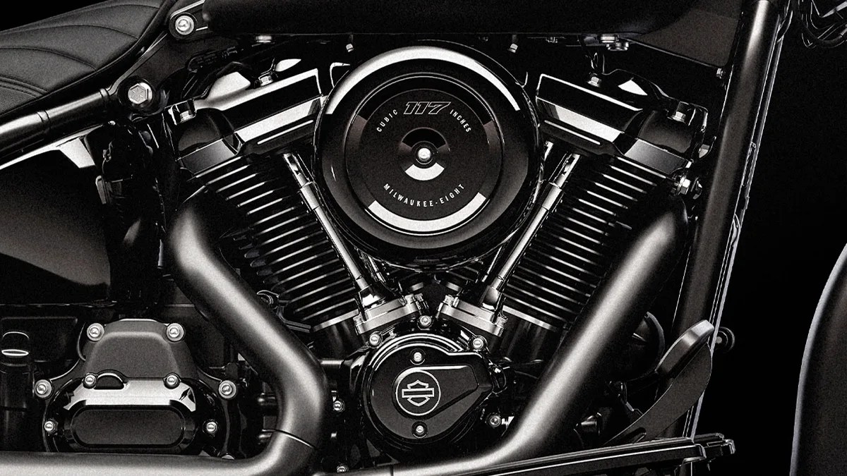 Close-up of a black Milwaukee-Eight 117 cubic inch motorcycle engine with matte and glossy finishes.