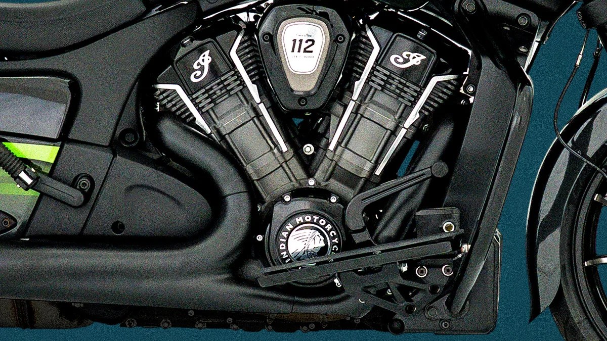 Close-up of a black Indian Motorcycle engine with "112" and "Indian Motorcycle" logos visible.