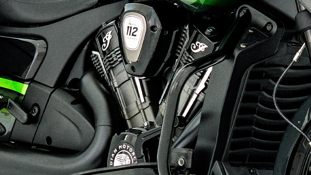 Close-up of a black Indian Motorcycle engine with "112" and "Indian Motorcycle" logos visible.