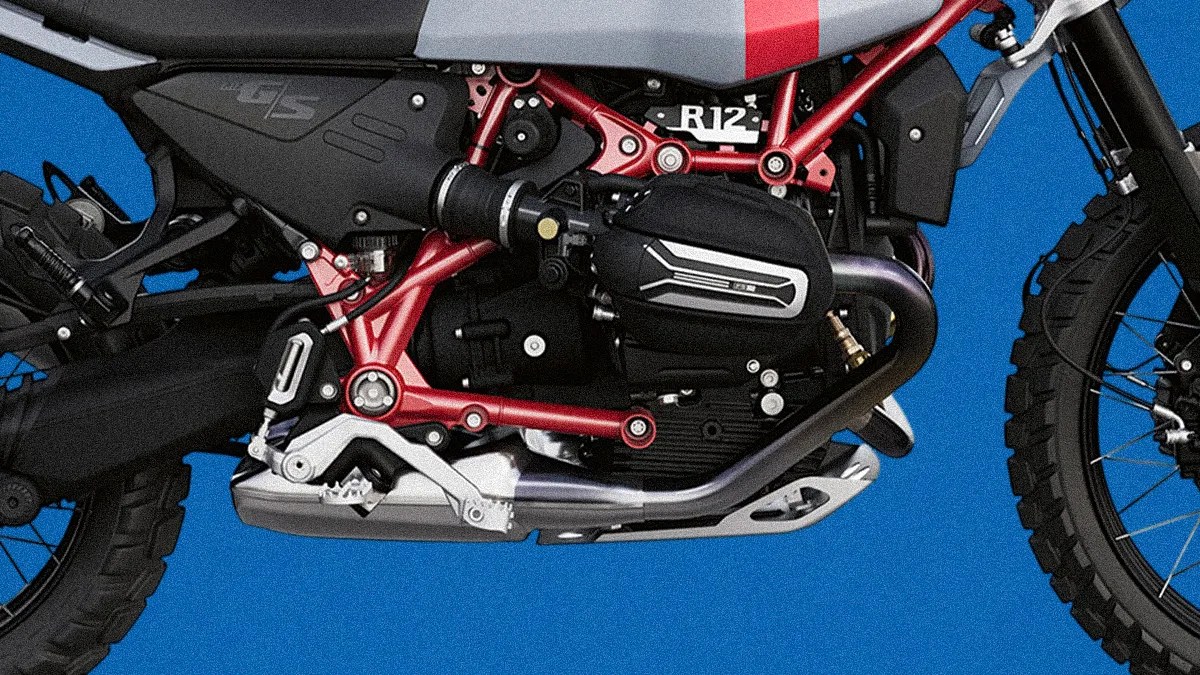 Close-up of a motorcycle engine with red frame, black casing labeled "R12," and silver exhaust pipe against a blue background.